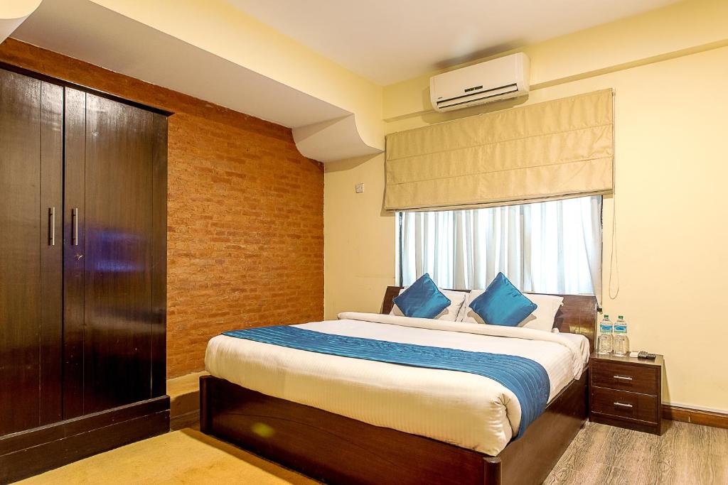 Voodi või voodid majutusasutuse Gaju Suite Hotel toas