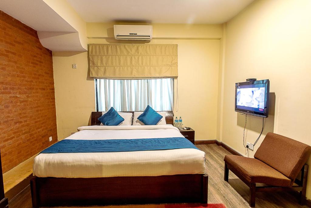 Voodi või voodid majutusasutuse Gaju Suite Hotel toas