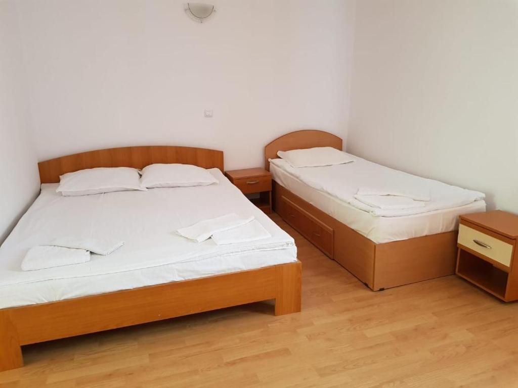 Postel nebo postele na pokoji v ubytování Hotel Magnolia
