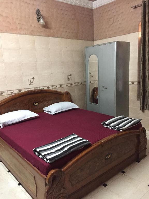 Postel nebo postele na pokoji v ubytování Royal Residency