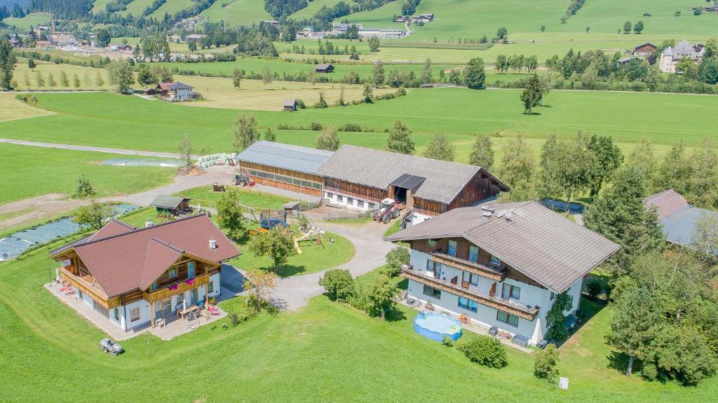 an aerial view of a large house on a field at Palfengut in Altenmarkt im Pongau