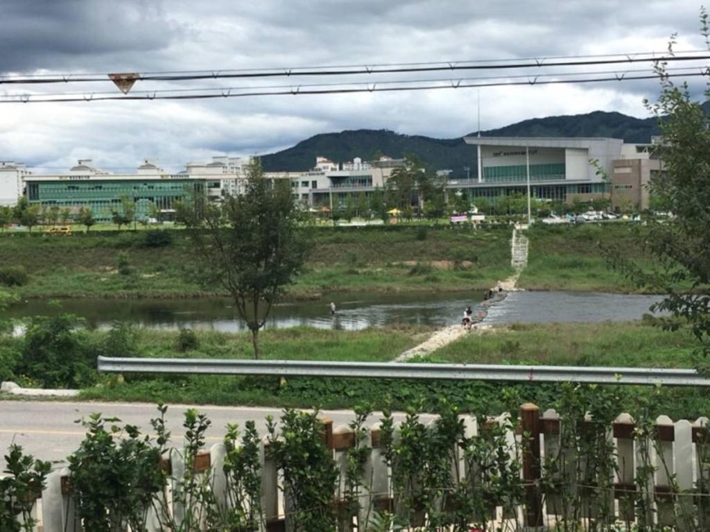 a view of a street with a building in the background at Grace River House Block A - Couple Room in Hoengsong