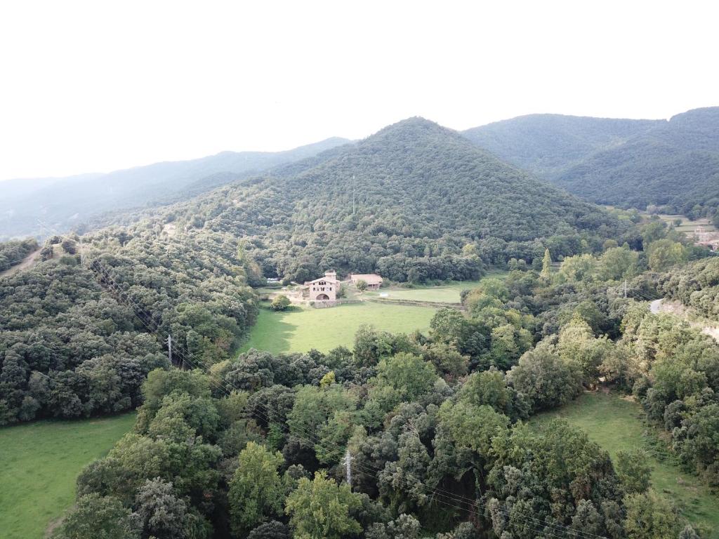 an aerial view of a house in the mountains at Casa Rural El Callís in Vall de Bianya