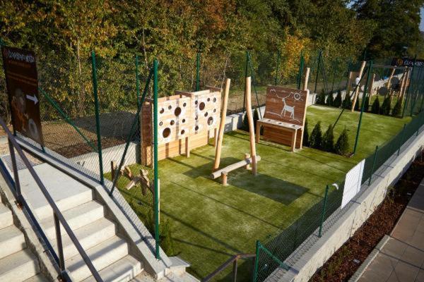 a park with a playground with a swing at APARTMÁNY RYBNÍČEK in Staré Město