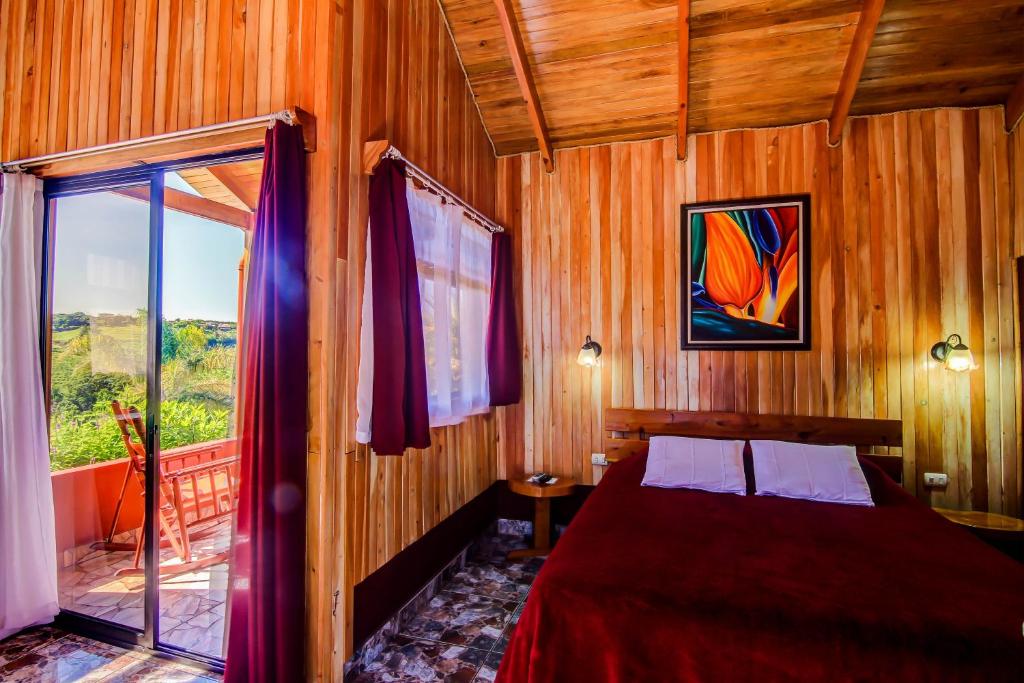 Postel nebo postele na pokoji v ubytování Hotel Mango Valley