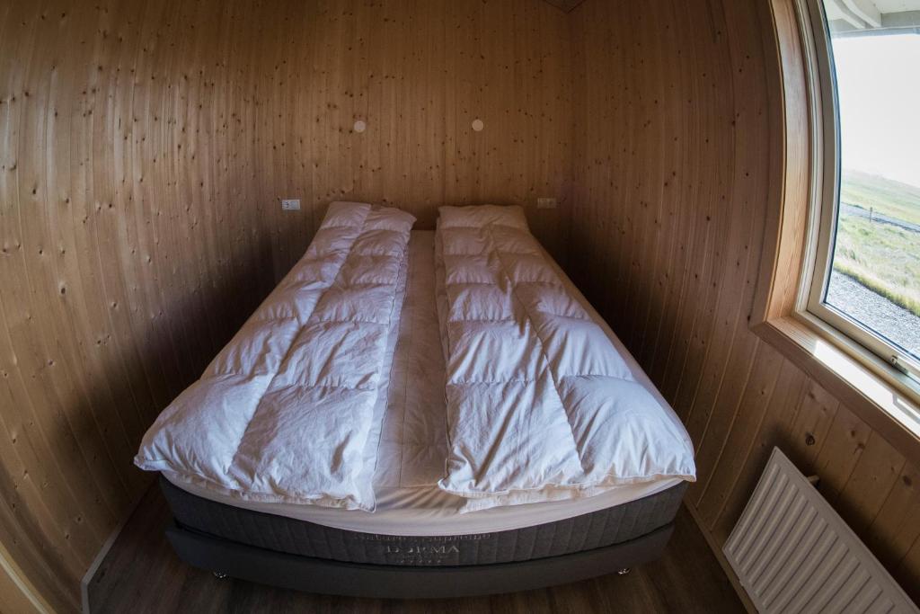 Postel nebo postele na pokoji v ubytování Myllulækur