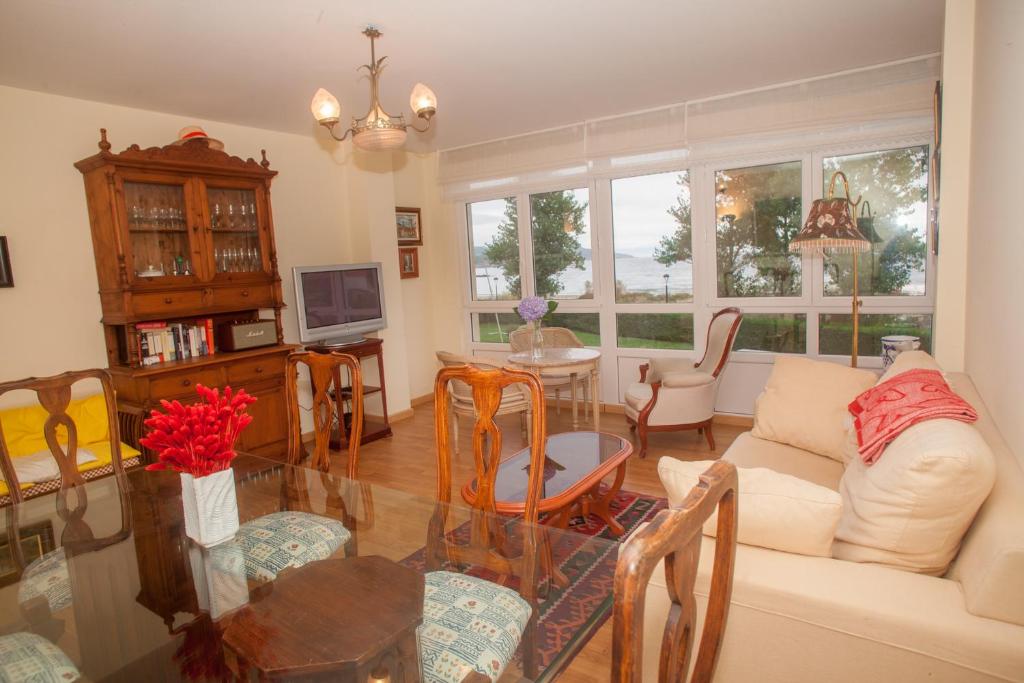 a living room with a couch and a table at Beatiful holiday flat in Galicia with sea views and next to the "Camino de Santiago" in Estorde