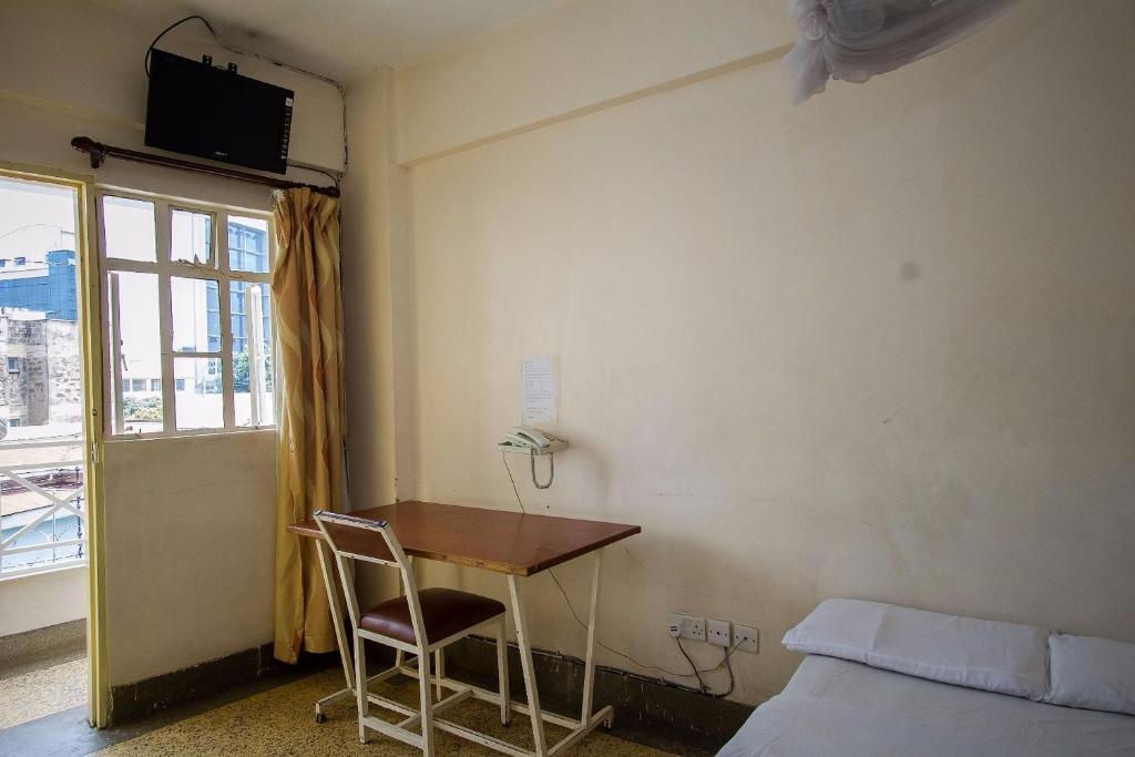 Postel nebo postele na pokoji v ubytování Rabi Hotel