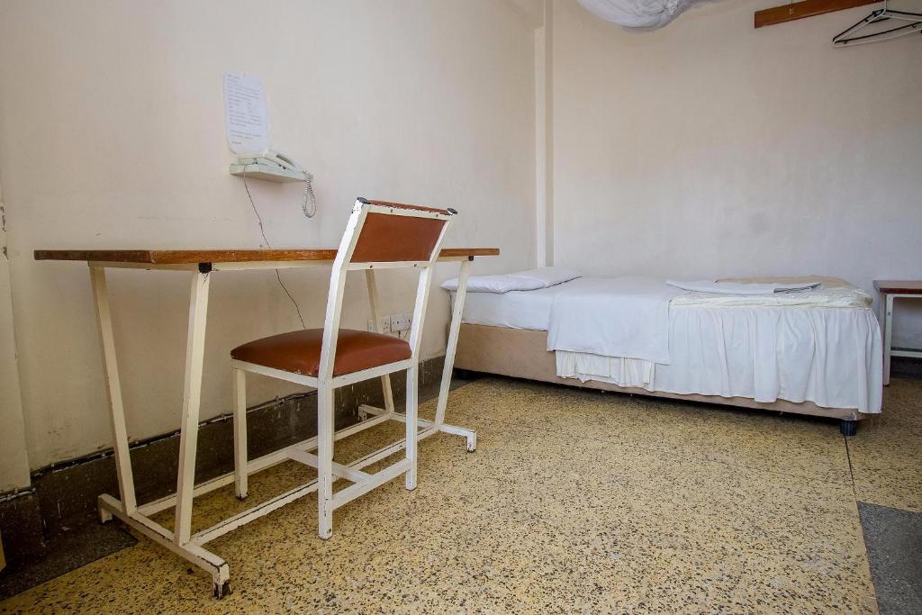Postel nebo postele na pokoji v ubytování Rabi Hotel