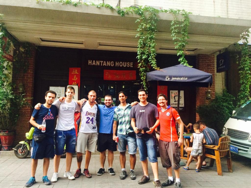 a group of men standing in front of a building at Xi'an Hantang House in Xi'an