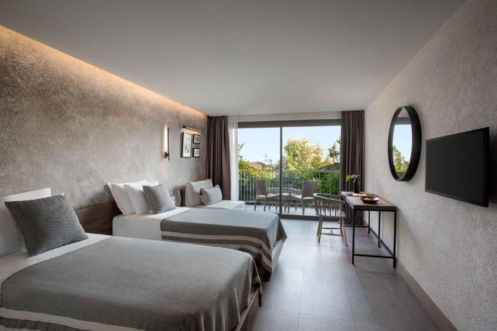 A bed or beds in a room at Club Marvy