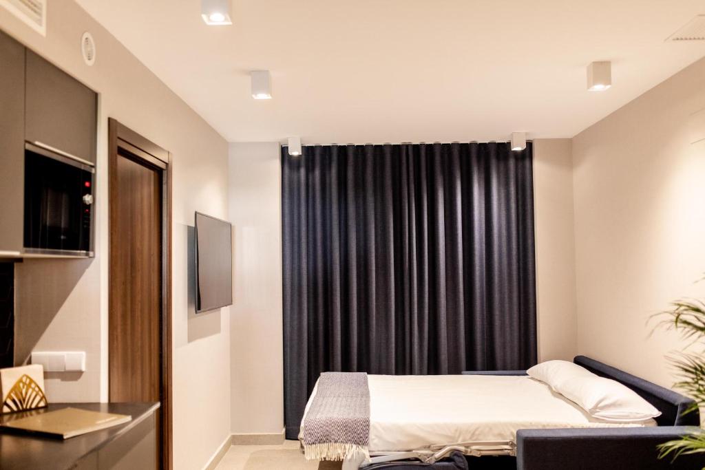 Letto o letti in una camera di Ramirez Flats Valencia