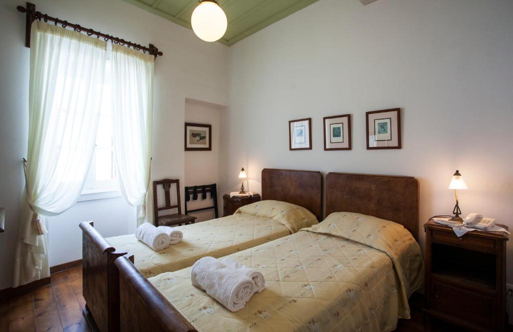 Postel nebo postele na pokoji v ubytování Nostos Guesthouse