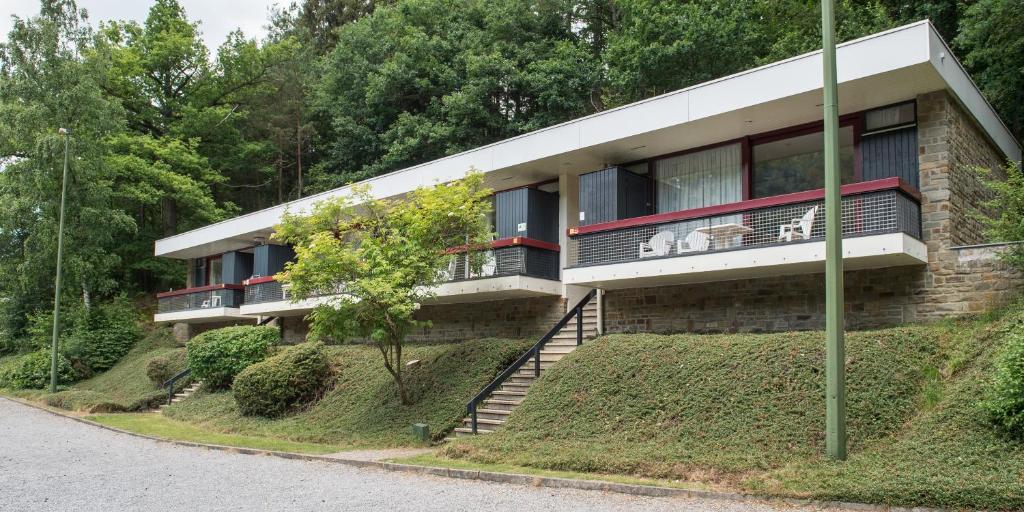 a house on a hill with a balcony at Domaine Long Pre in Stavelot