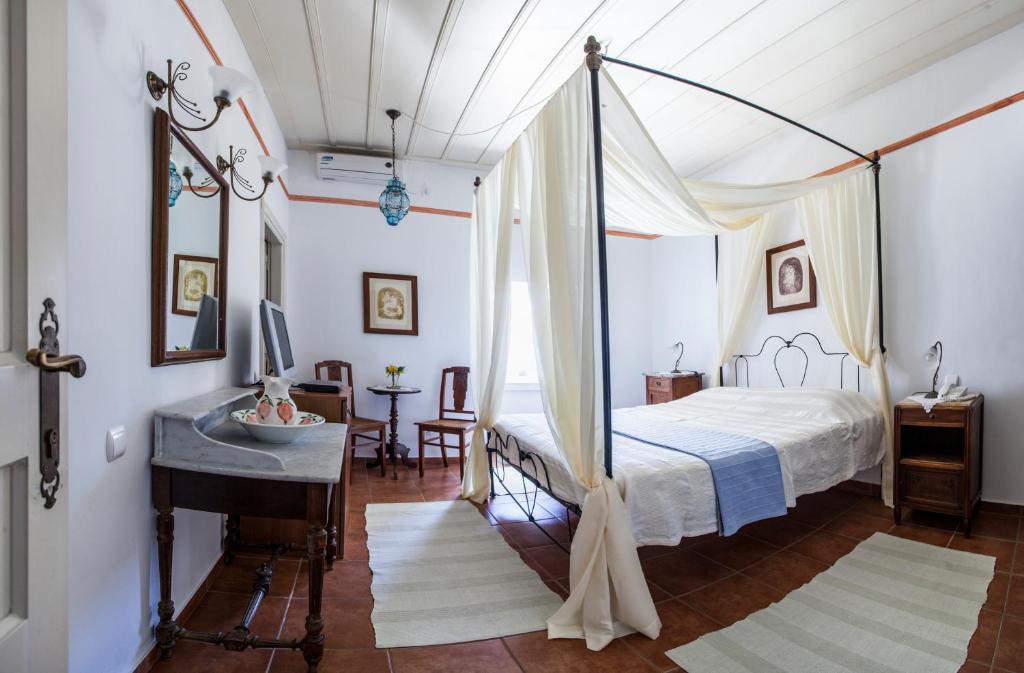 Postel nebo postele na pokoji v ubytování Nostos Guesthouse