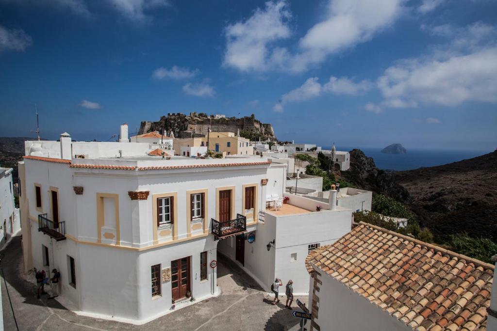 a group of people standing on top of a building at Nostos Guesthouse in Kythira
