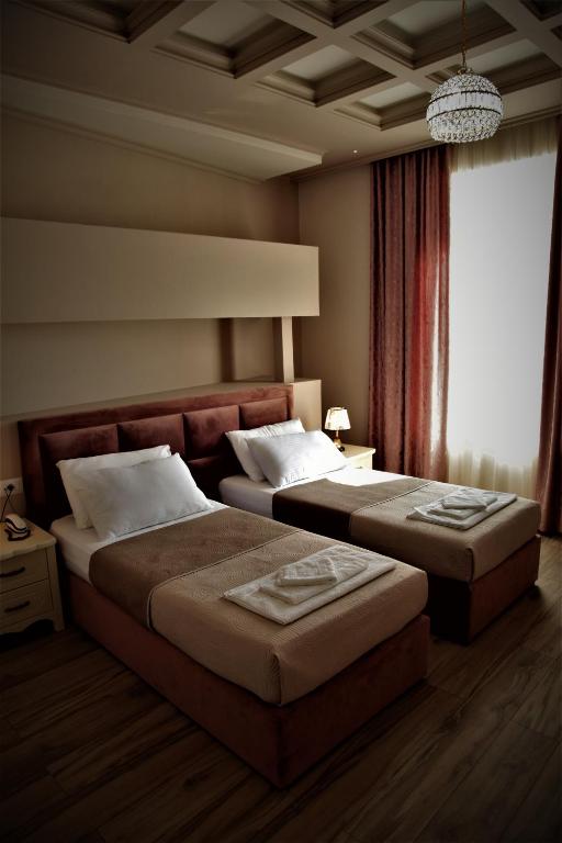 Postel nebo postele na pokoji v ubytování Hotel Veliera