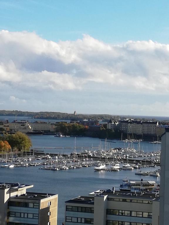 a view of a harbor with boats in the water at apartment in great location in Helsinki