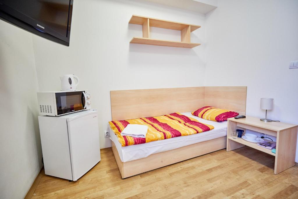 Postel nebo postele na pokoji v ubytování University Hotel