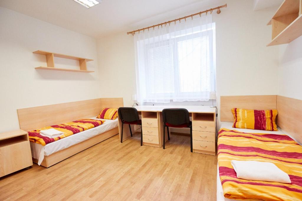 Postel nebo postele na pokoji v ubytování University Hotel