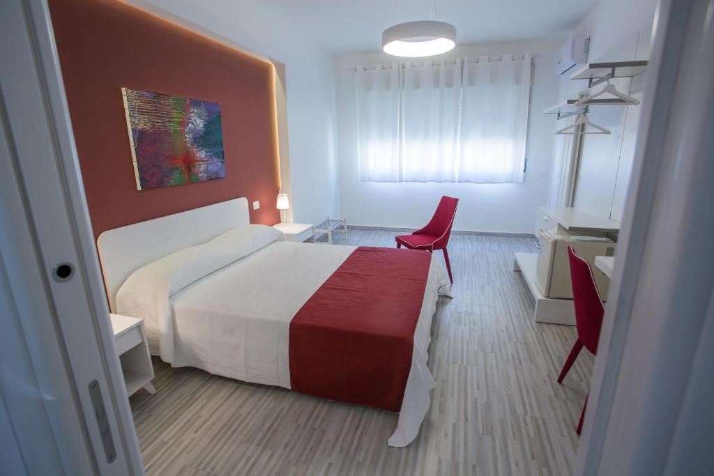 Postel nebo postele na pokoji v ubytování B&B al Centro