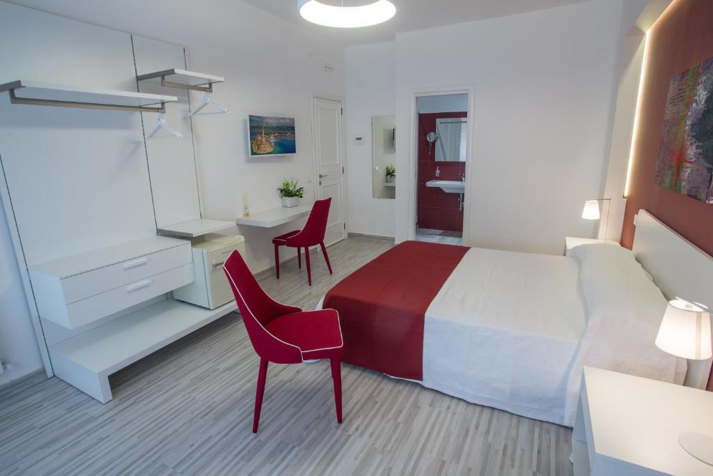 Postel nebo postele na pokoji v ubytování B&B al Centro