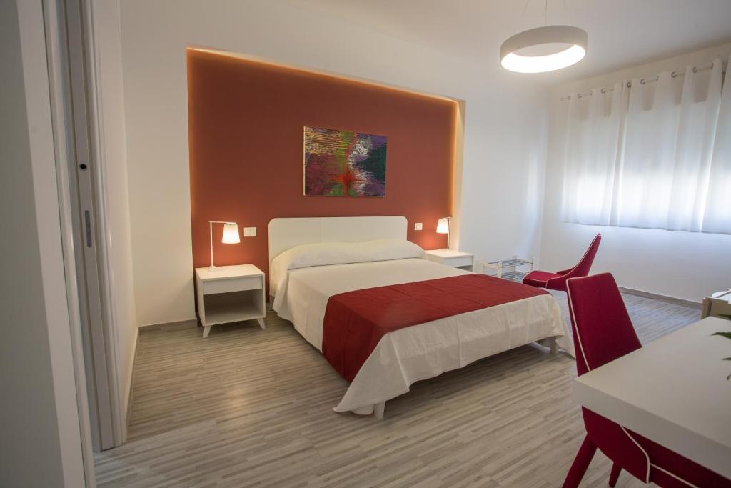 Postel nebo postele na pokoji v ubytování B&B al Centro