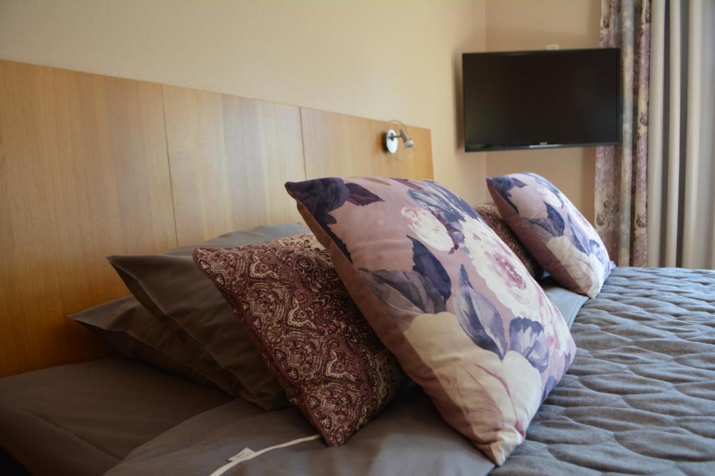 Postel nebo postele na pokoji v ubytování Hotell Lyktan