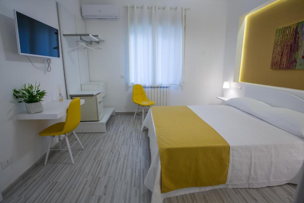 Postel nebo postele na pokoji v ubytování B&B al Centro