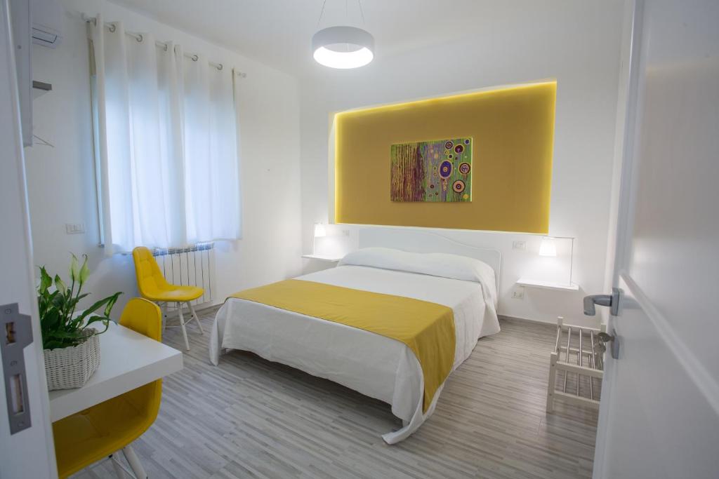 Postel nebo postele na pokoji v ubytování B&B al Centro