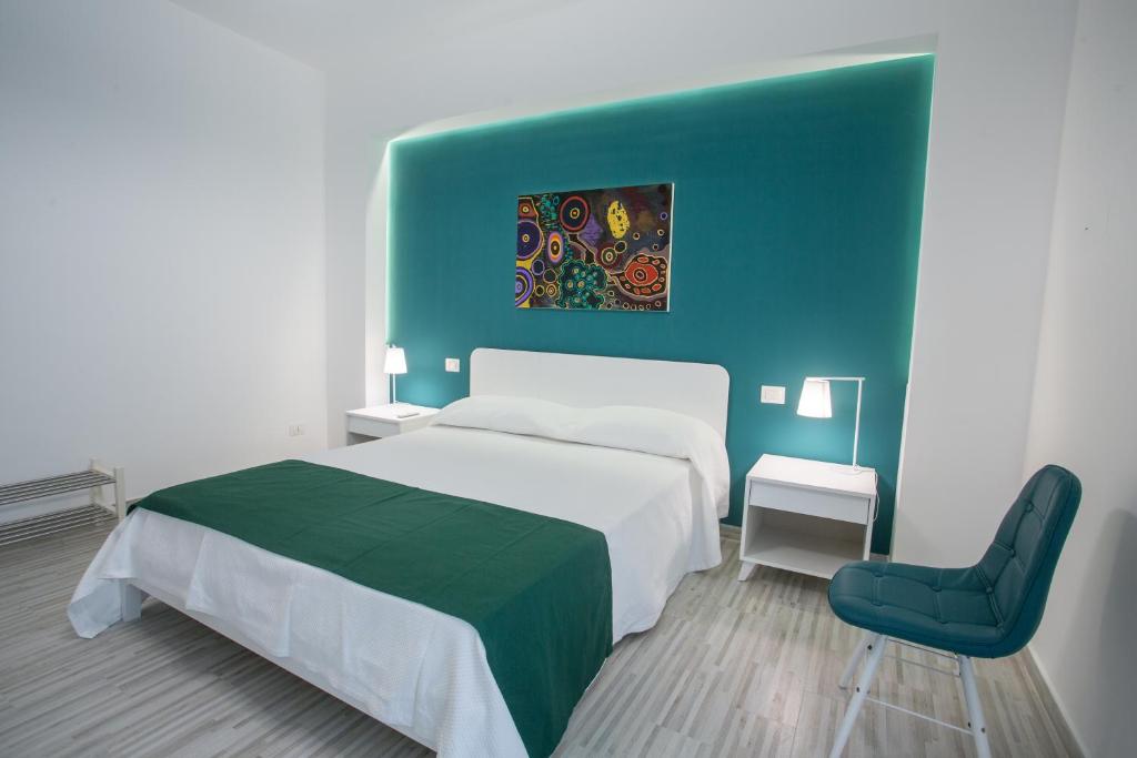 Postel nebo postele na pokoji v ubytování B&B al Centro