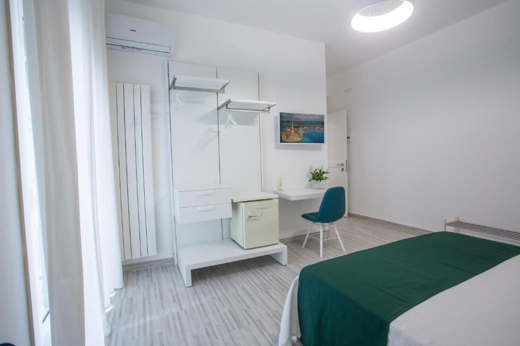 Postel nebo postele na pokoji v ubytování B&B al Centro
