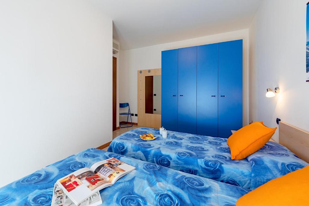 Posteľ alebo postele v izbe v ubytovaní La Mimosa B03 Apartment by Wonderful Italy