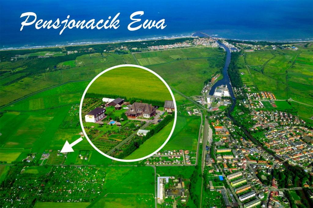 a circle in the middle of a city with a house at Pensjonacik Ewa in Darłowo
