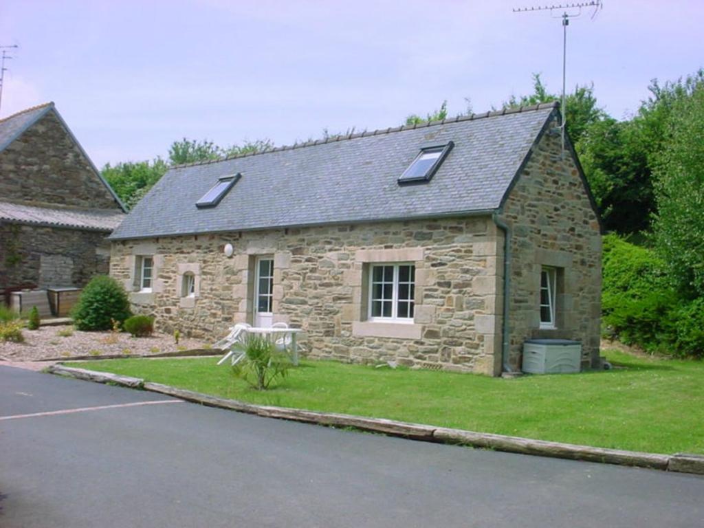 a stone house with skylights on top of it at La Bergerie in Camlez