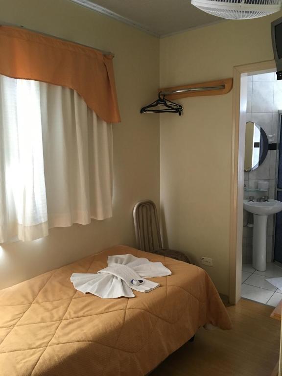 Postel nebo postele na pokoji v ubytování Elite Palace Hotel