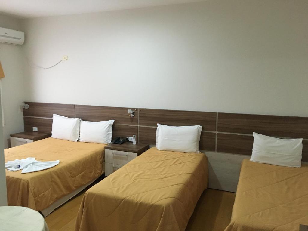 Postel nebo postele na pokoji v ubytování Elite Palace Hotel