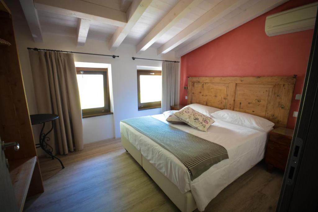 Posteľ alebo postele v izbe v ubytovaní Cascina Varini