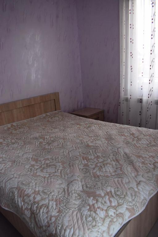 Postel nebo postele na pokoji v ubytování Guest house BAGRATIONI