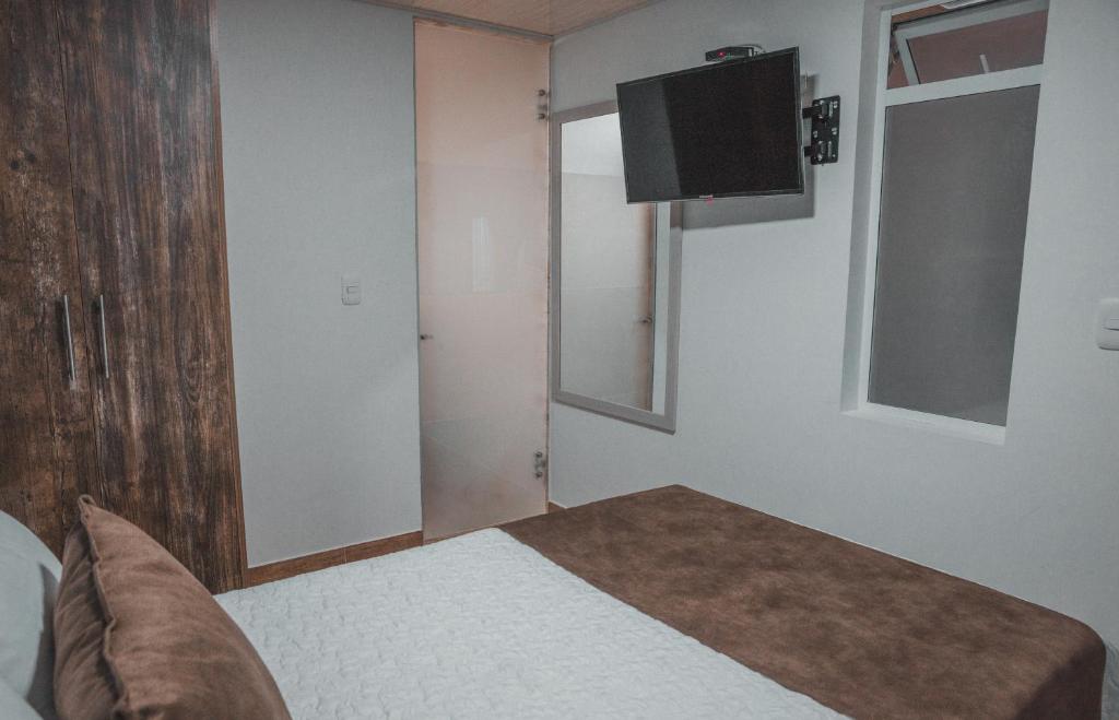 Postel nebo postele na pokoji v ubytování HOTEl PACHAMAMA SPA
