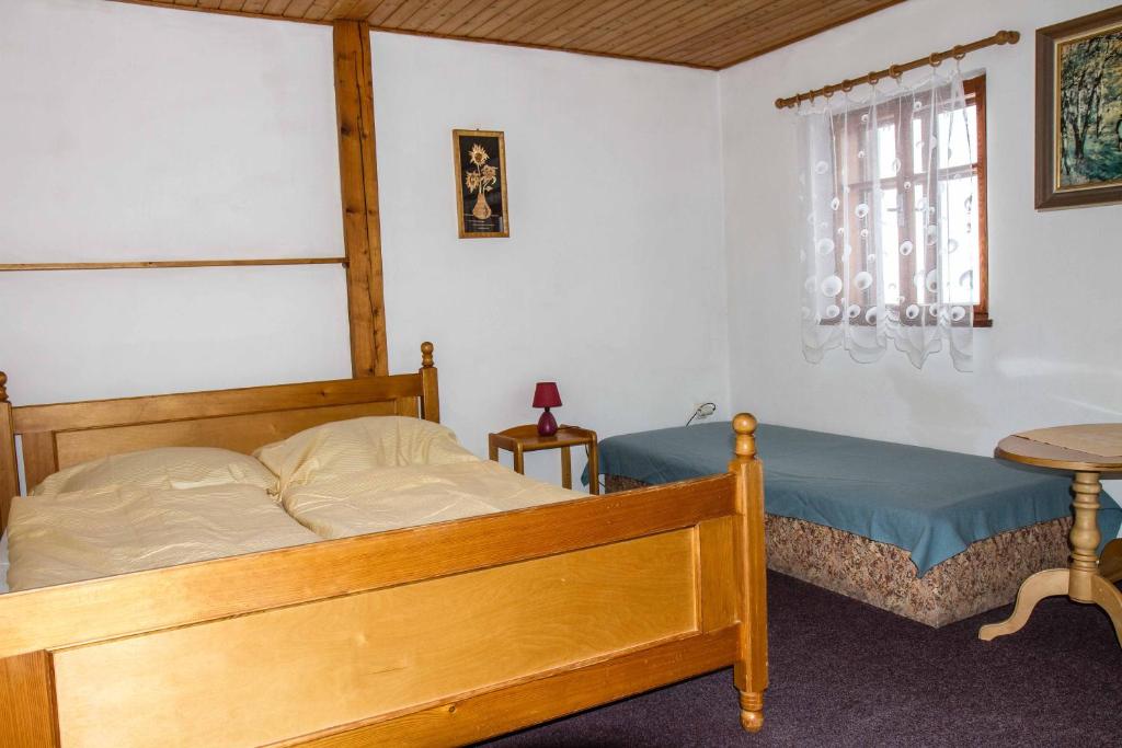 Postel nebo postele na pokoji v ubytování Horský Ranč