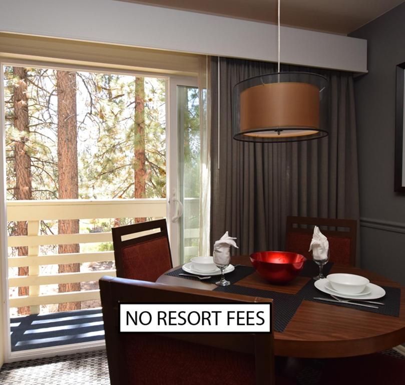 a dining room table with a sign that says no resort fees at Lodge at Kingsbury Crossing in Stateline
