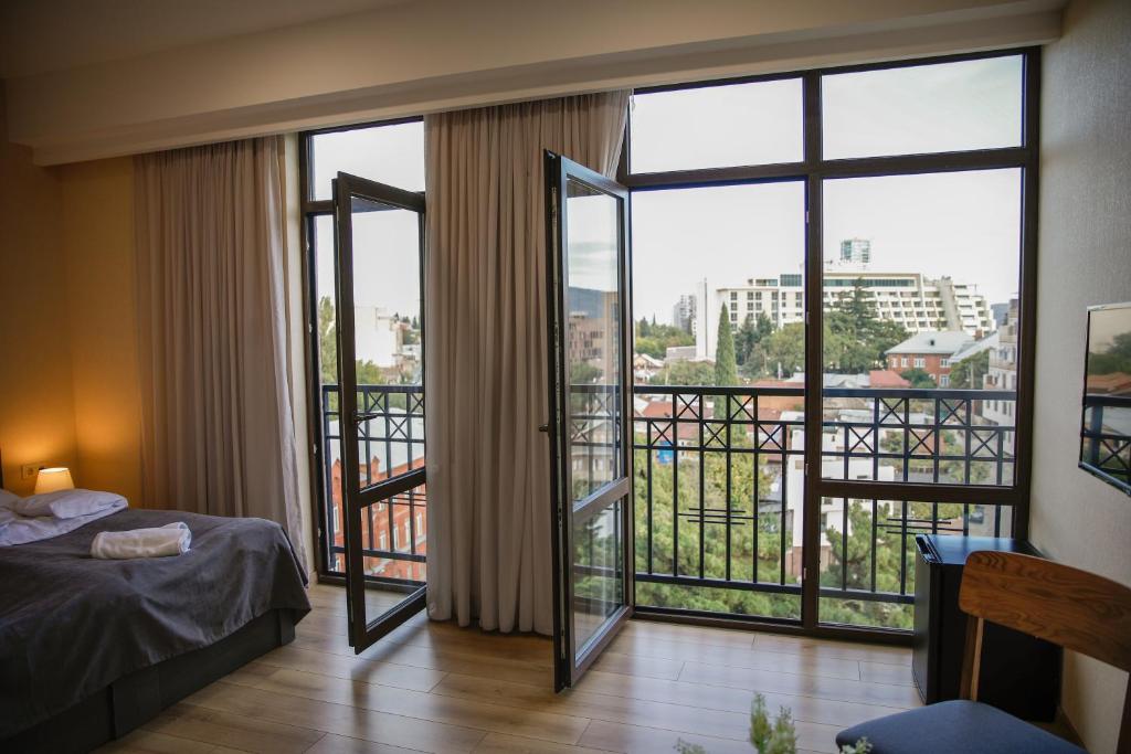 Postel nebo postele na pokoji v ubytování Hotel Avlabari Terrace