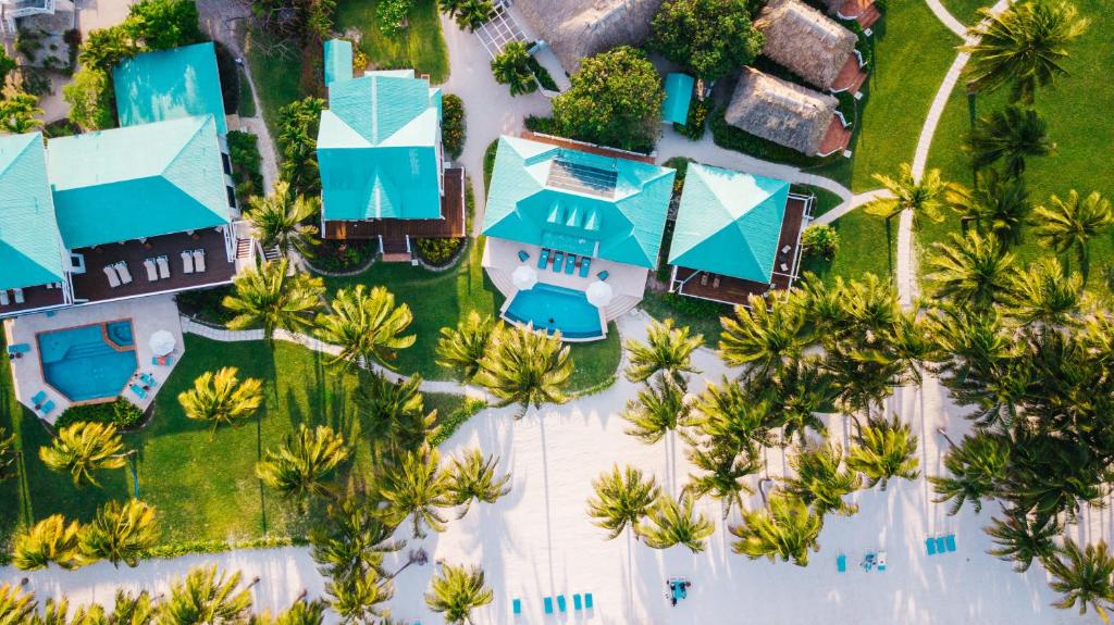 an overhead view of a resort with blue roofs at Victoria House Resort & Spa in San Pedro