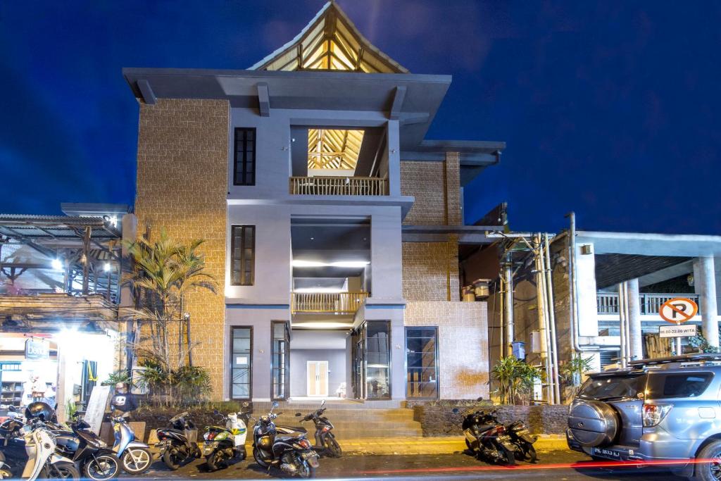 a group of motorcycles parked in front of a building at A4k Mua at Ubud in Ubud