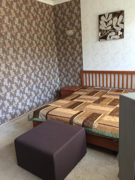 Un pat sau paturi într-o cameră la Guest House on Volga