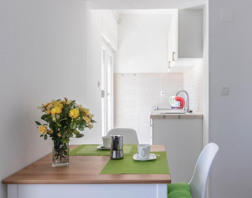 Kuchyň nebo kuchyňský kout v ubytování Adriana Holiday Apartment