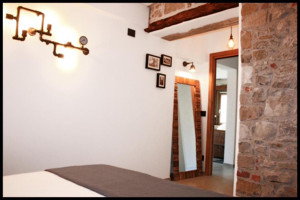 A bed or beds in a room at Casa Vacanze Borc dai Cucs