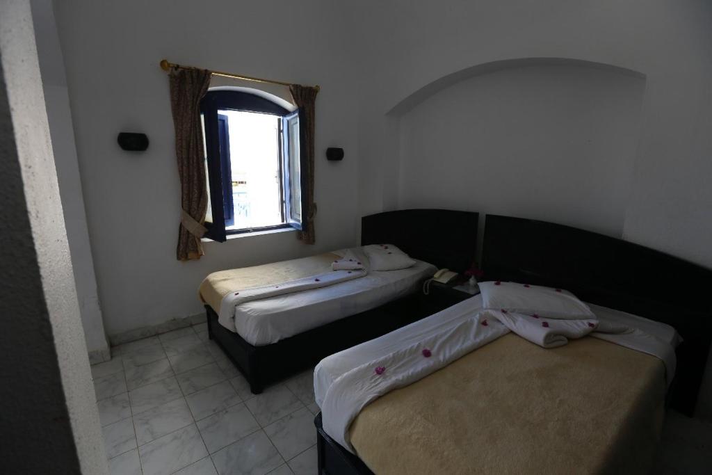 Postel nebo postele na pokoji v ubytování New Panorama Resort
