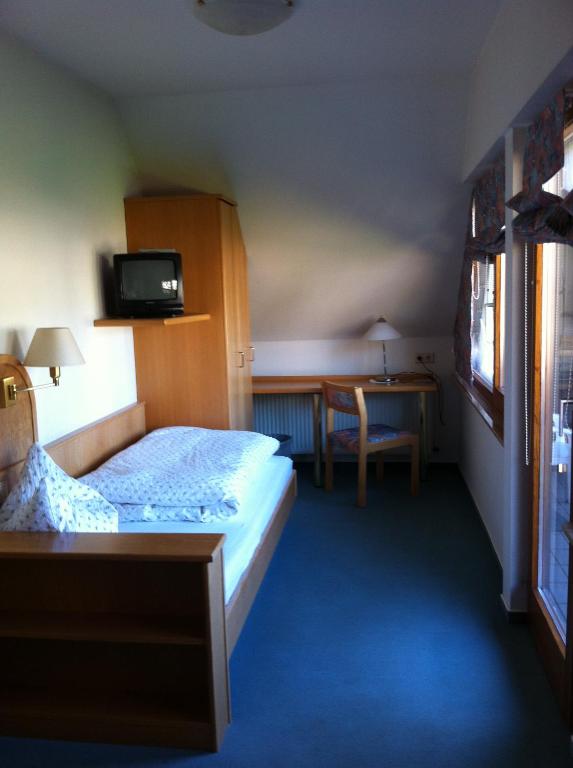Postel nebo postele na pokoji v ubytování Gasthof Richebächli